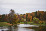Fototapeta Paryż - autumn Park. yellow and orange autumn trees by the lake.