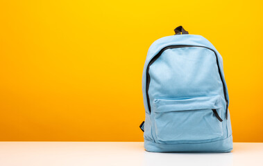 Back to school background. Stationery Supplies in the school bag. Banner design education On Yellow background.