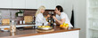 © LIGHTFIELD STUDIOS - young couple clinking glasses of red wine in kitchen, banner
