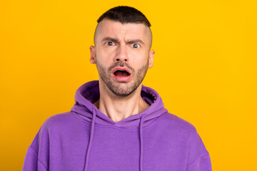 Wall Mural - Photo portrait young man wearing violet pullover staring amazed got trouble isolated bright yellow color background