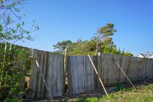 Falling Down And Damaged Wooden Fence