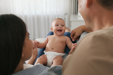 Poster - Happy family with their cute baby at home