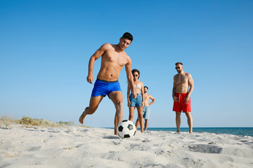 Poster - Group of friends playing football on beach