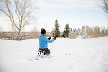 Senior Sit-skier Wearing Beanie Skiing In Winter