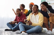 © Prostock-studio - Cheerful african american friends playing video games at home