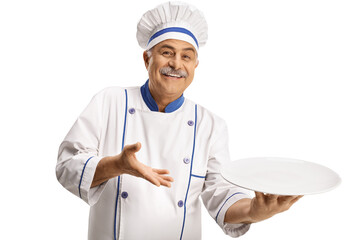 Poster - Cheerful male chef smiling and holding an empty plate