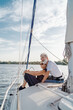 © luengo_ua - Romantic vacation and luxury travel. Senior loving couple sitting on the yacht deck. Sailing the river.