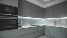 Modern Fully Fitted Kitchen With Kitchen Appliances In Grey And White