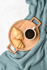 Wall Mural - Tray with delicious breakfast and knitted blanket on white background