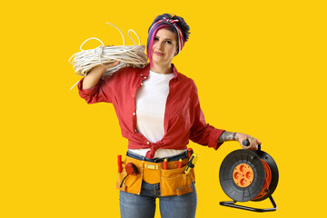 Sticker - Female electrician with tools on color background