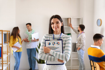 Poster - Beautiful woman with clipboard in office