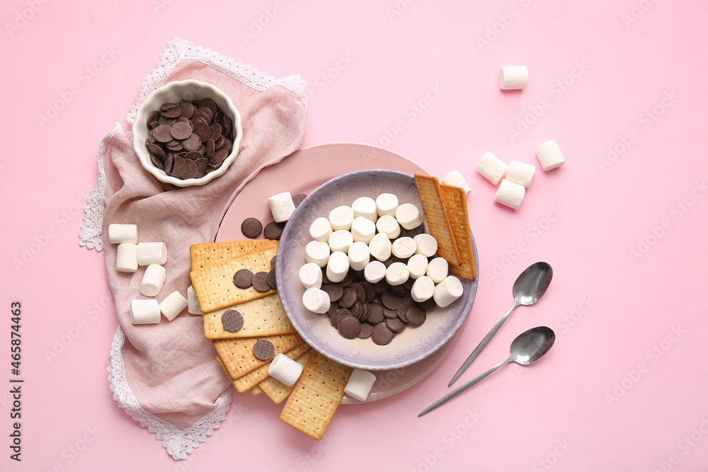 Ingredients for preparing S'mores dip on pink background
