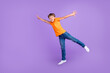 © deagreez - Full length body size photo boy jumping careless catching blank space isolated pastel violet color background