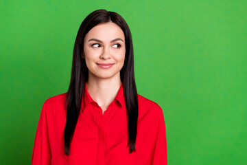 Wall Mural - Photo of friendly brunette young lady look empty space wear red shirt isolated on green color background