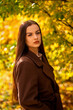 © Bernhard - Portrait of a young woman in a brown coat in autumn