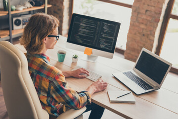 Profile side photo of young man programmer type laptop coder cyber space testing office desk indoors