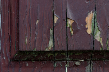 Wall Mural - Fragments old street wood door to the house. Fragment of an old red wooden door. Weathered front door.