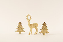 Minimalistic Creative Idea Of White Christmas Made Of Gold  Glitter Trees And Reindeer On Bright Background. Winter Holiday Concept. Copy Space.