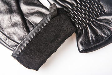 Fashion black leather gloves on white background