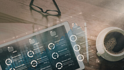 Top view Kanban board framework on virtual modern digital tablet computer showing innovation Agile software development lean project management tool for fast changes on wood desk and coffee cup.