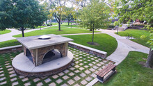 Outdoor Campus Firepit Enclosure Surrounded By Trees