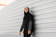 Portrait Of Cheerful Young Muslim Lady Posing In Modest Sportswear Outdoors