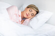 © Prostock-studio - Beautiful mature woman sleeping well on pillow