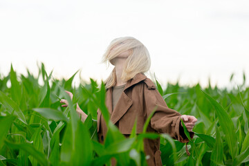 Canvas Print - Blonde woman in cloak in cornfield in summertime