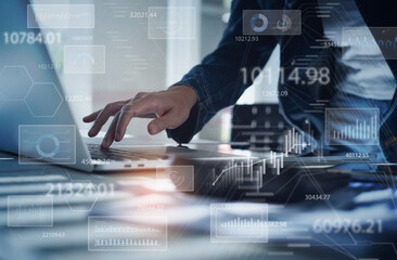 businesswoman working on laptop computer analyzing sales data and economic growth graph chart. busin