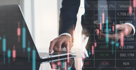 Wall Mural - Business man, trader using laptop computer monitoring and analysing stock market report at office with financial forex graph chart