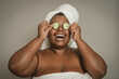 © Alessandro Biascioli - Happy curvy African woman having skin care spa day - People wellness and self care lifestyle concept