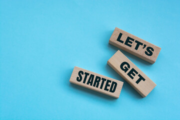 Wall Mural - above are three wooden blocks with the words let is get started.