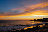 Fototapeta Niebo - Late sunset over the Carcavelos beach Portugal.