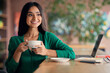 © Prostock-studio - Pretty middle eastern woman student drinking tea at cafe