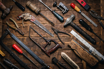 Wall Mural - Various old retro style construction work tools on the wooden workbench flat lay background.