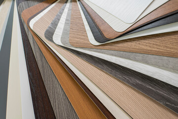 Samples of eco-veneer material in various colors for covering interroom doors, furniture. Examples of colors and textures of eco-veneer close-up.