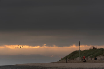 Wall Mural - beautiful sunrise landscape image of talacre beach at surnise with dramatic sky and clouds