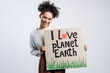 © speed300 - Multiracial cheerful woman holding carton placard with I love planet Earth writing. Concept of nature destruction and eco activism