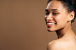 © speed300 - Close up portrait of attractive multiracial lady with naked shoulders looking away with serene expression and having smile at her face