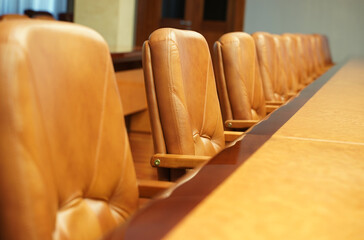 Conference room interior, empty rows of chairs.