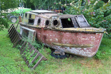 Old Wooden Fishing Boat Rots On The Shore