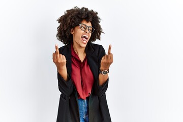 Wall Mural - African american woman with afro hair wearing business jacket and glasses showing middle finger doing fuck you bad expression, provocation and rude attitude. screaming excited