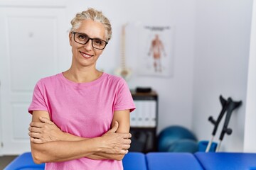 Sticker - Middle age blonde woman at pain recovery clinic happy face smiling with crossed arms looking at the camera. positive person.