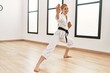 © Krakenimages.com - Young caucasian woman smiling confident training karate at sport center