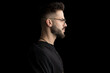© Viorel Sima - side view of bearded sexy young man wearing glasses and looking to side