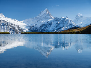Wall Mural - high mountains and reflection on the surface of the lake. mountain valley with lake. landscape in th