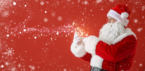 Poster - Portrait of Santa Claus with mobile phone on color background with space for text