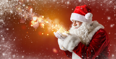 Portrait of Santa Claus playing with snow on color background with space for text