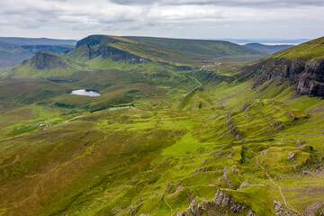 Wall Mural - Aerial view of spectacular jagged rock formations at a remote, highlands location (Quiraing, Isle of Skye)