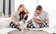 © tan4ikk - Family with dog in the bed